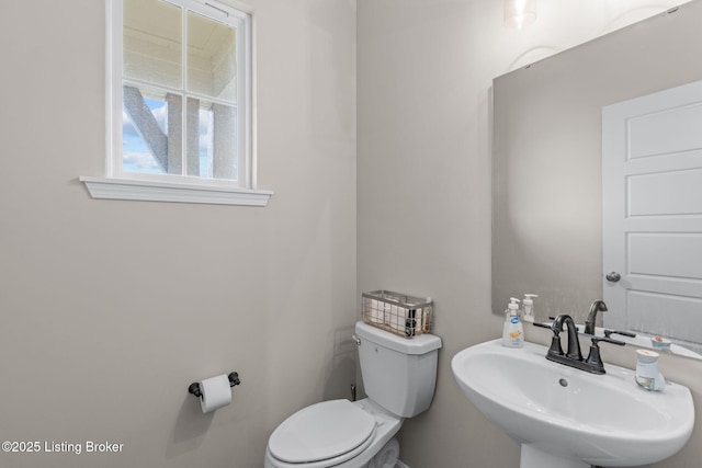 bathroom with toilet and sink