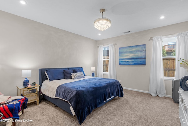 bedroom with light colored carpet