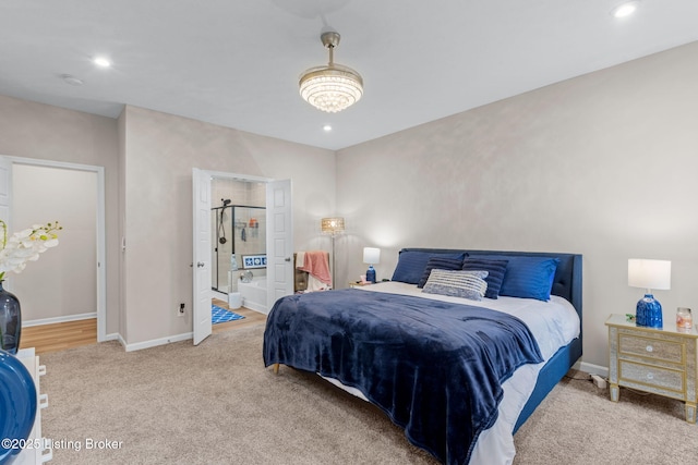 carpeted bedroom with ensuite bath