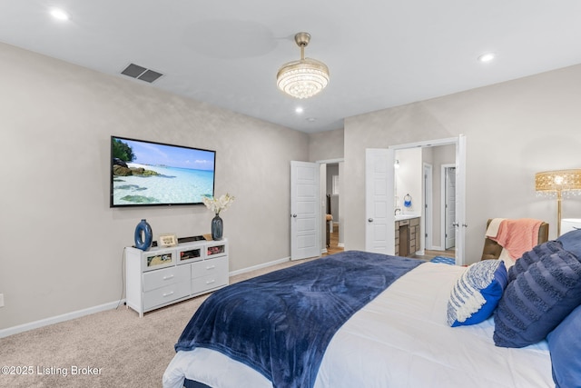 carpeted bedroom featuring ensuite bathroom