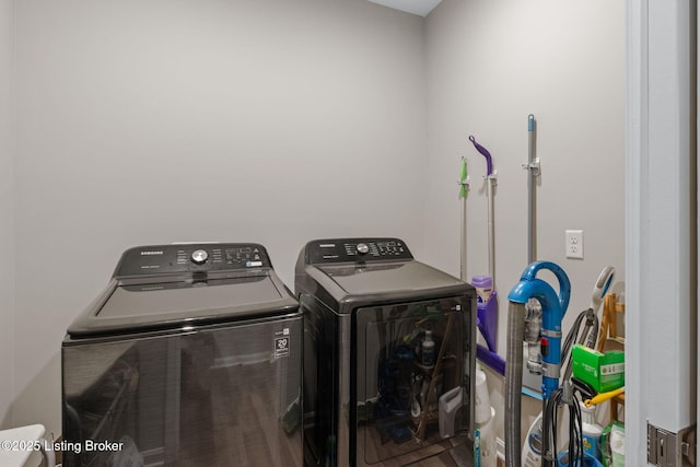 clothes washing area with washer and dryer