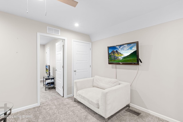 living area with light carpet