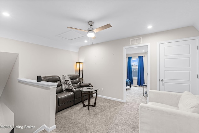 carpeted living room featuring ceiling fan