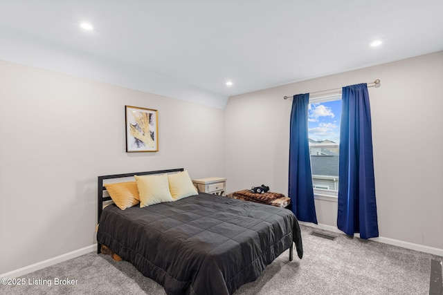 bedroom with a water view and carpet