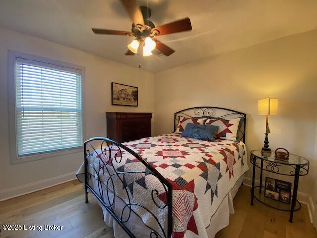 bedroom featuring ceiling fan and light wood-type flooring