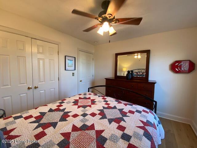 bedroom featuring wood-type flooring and ceiling fan