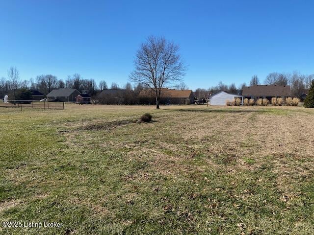 view of yard with a rural view