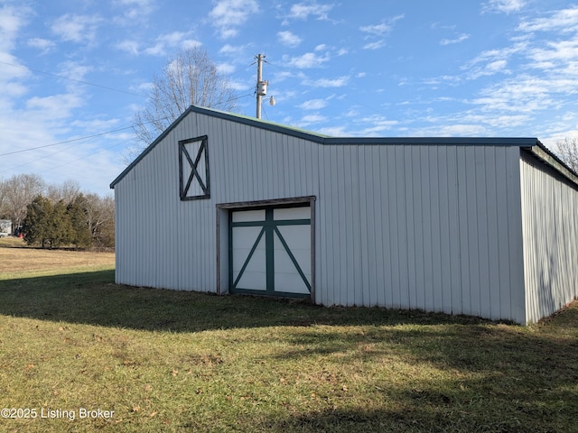 view of outbuilding featuring a yard and a garage