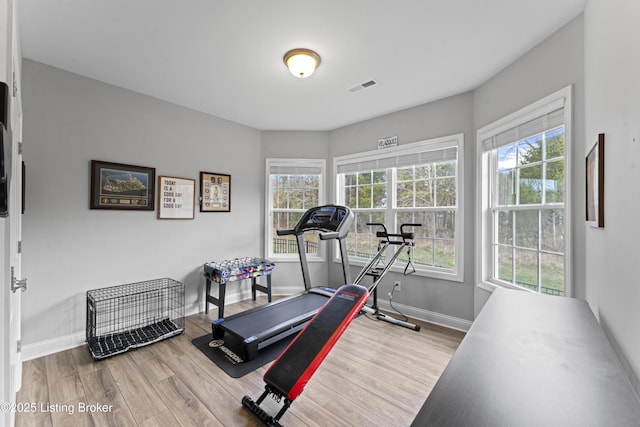 exercise area with wood-type flooring