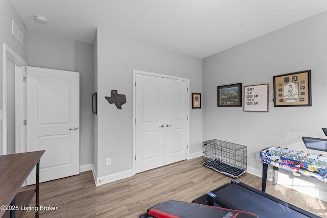 exercise area with hardwood / wood-style flooring