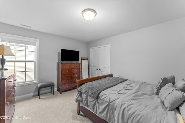 bedroom with light carpet