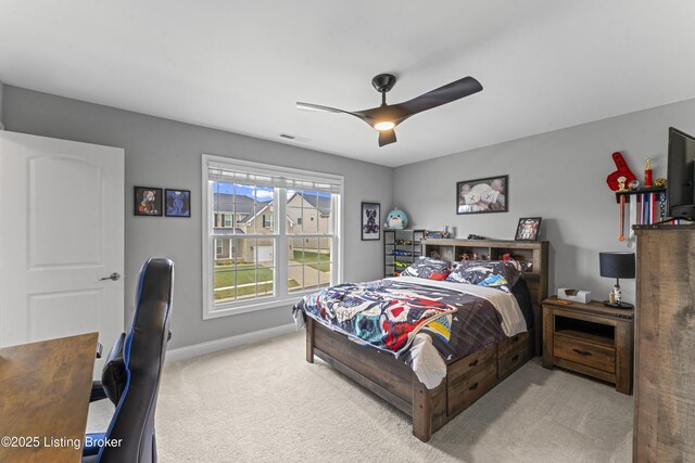 carpeted bedroom with ceiling fan