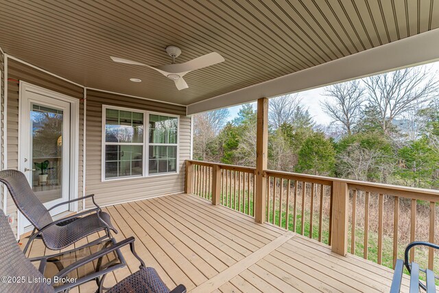 wooden deck featuring ceiling fan