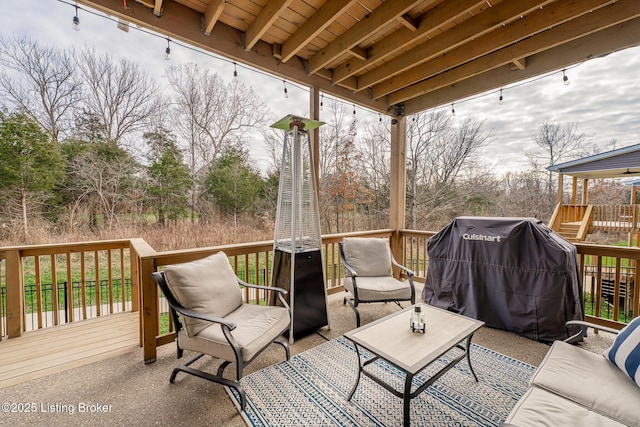 deck featuring outdoor lounge area and grilling area