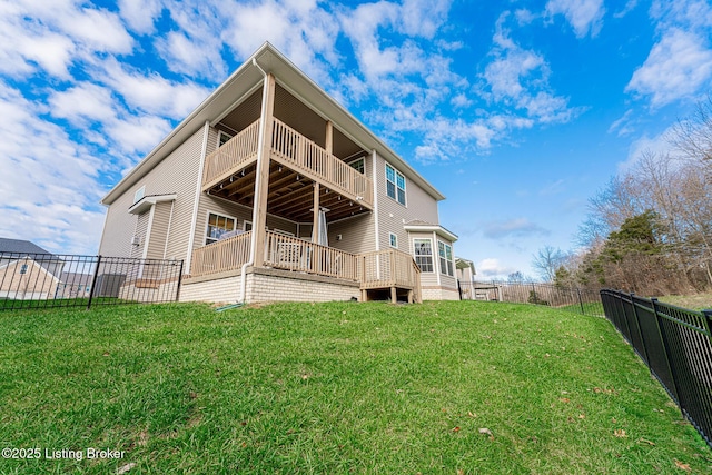 back of property featuring a balcony and a lawn