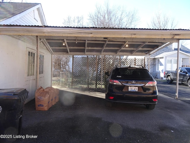 view of vehicle parking featuring a carport