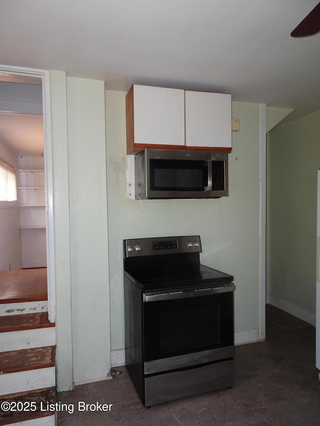 kitchen featuring white cabinets and appliances with stainless steel finishes