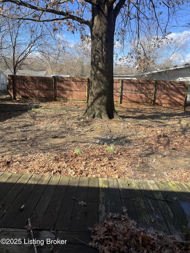 view of yard featuring a wooden deck