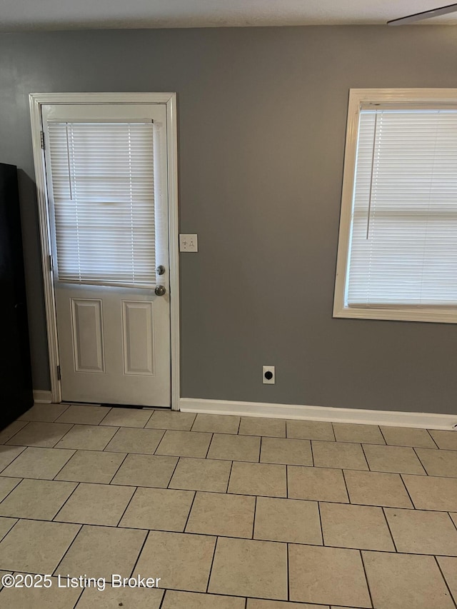 interior space with light tile patterned floors