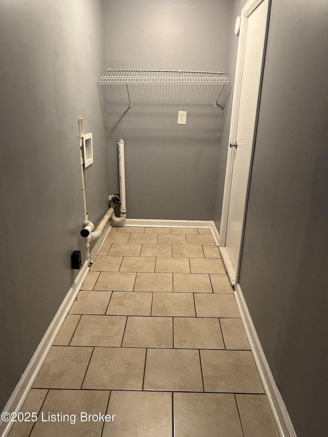 washroom featuring washer hookup and light tile patterned floors