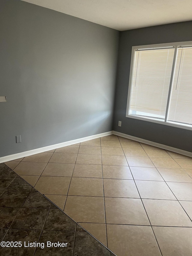 view of tiled spare room