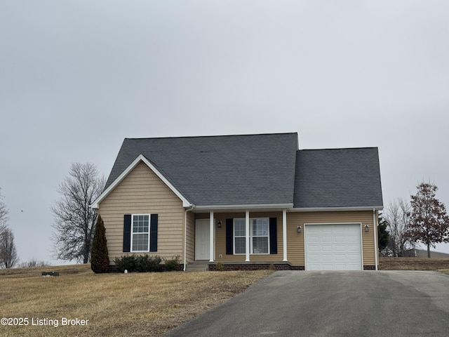 view of front of home featuring a garage and a front lawn