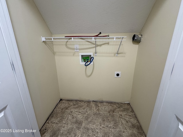 laundry area with hookup for a washing machine, a textured ceiling, and electric dryer hookup