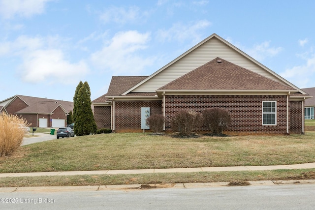 view of front of house featuring a garage and a front lawn