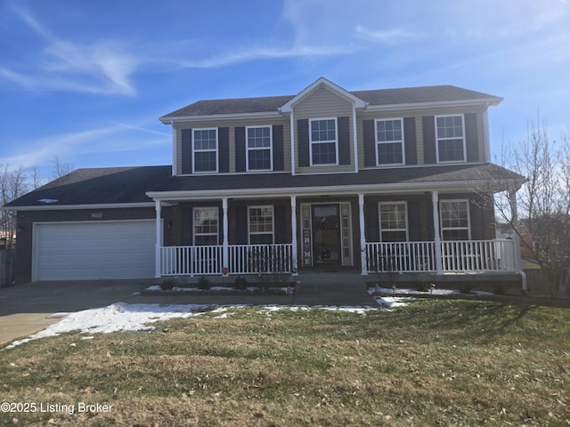 view of front of property featuring a garage, covered porch, and a front yard