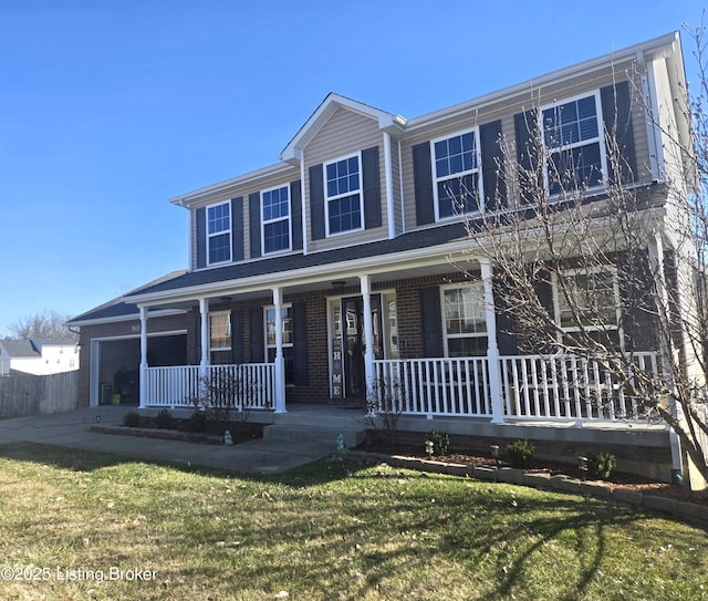 view of front of house featuring a front yard and covered porch