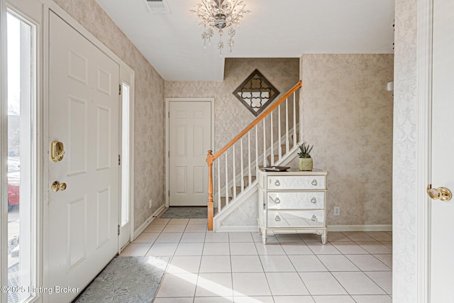 entrance foyer with light tile patterned floors