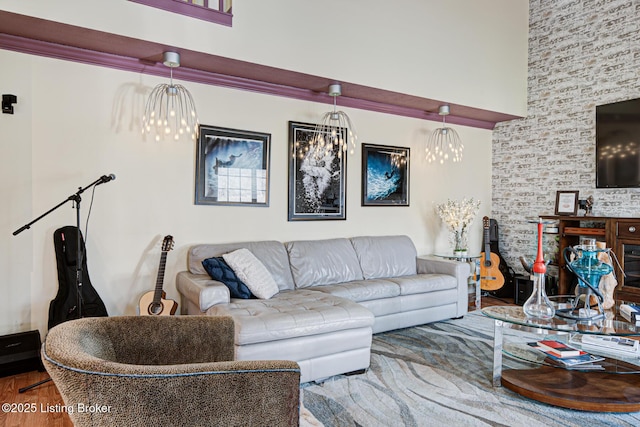 living room featuring wood-type flooring and a towering ceiling