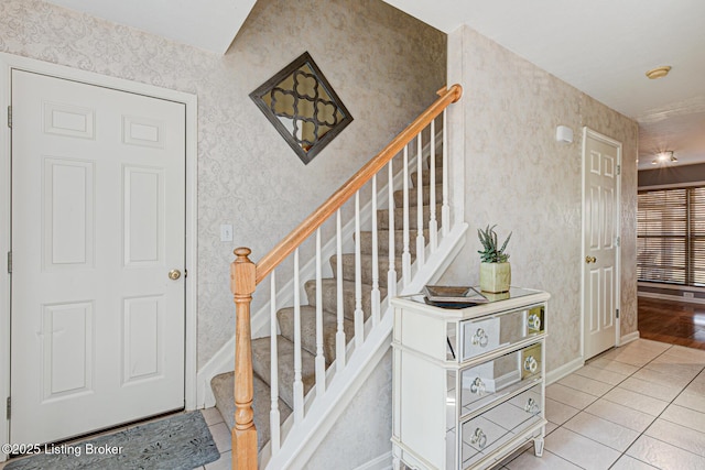 staircase featuring tile patterned floors