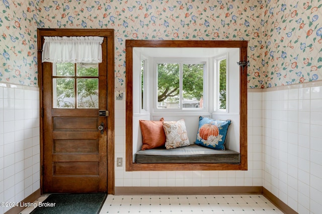 entryway featuring tile walls