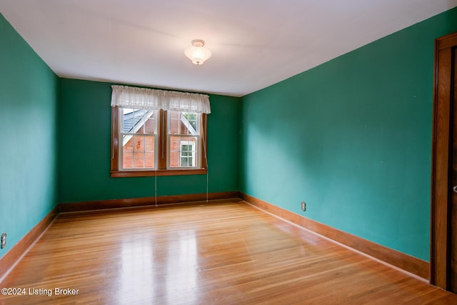 spare room featuring light hardwood / wood-style floors