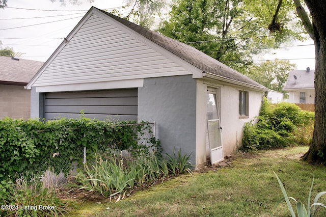 view of side of home with a lawn