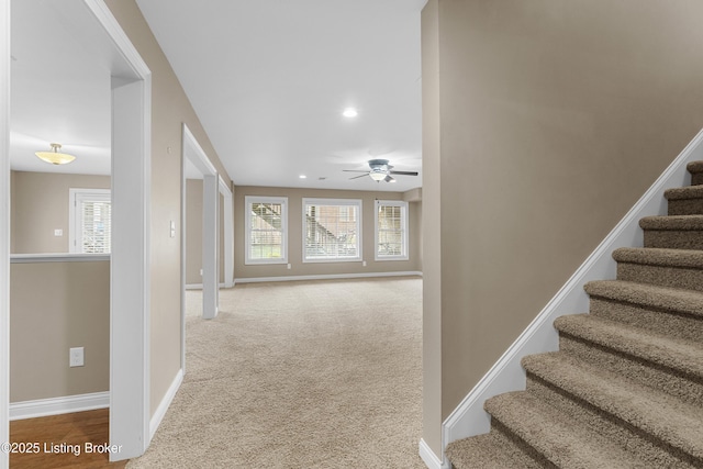 hallway with carpet floors