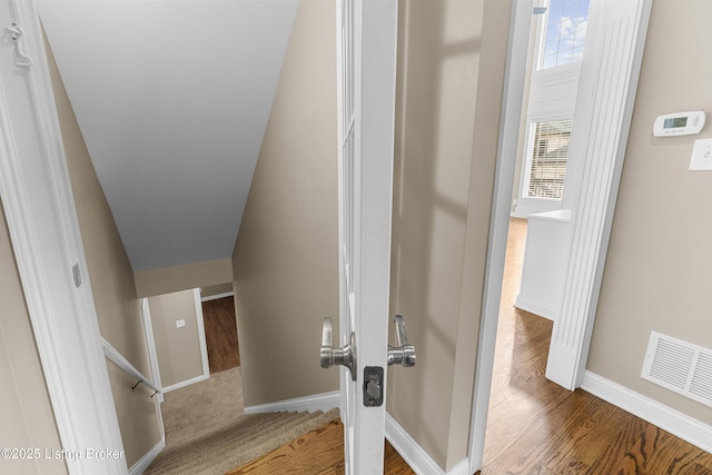 stairway featuring hardwood / wood-style floors