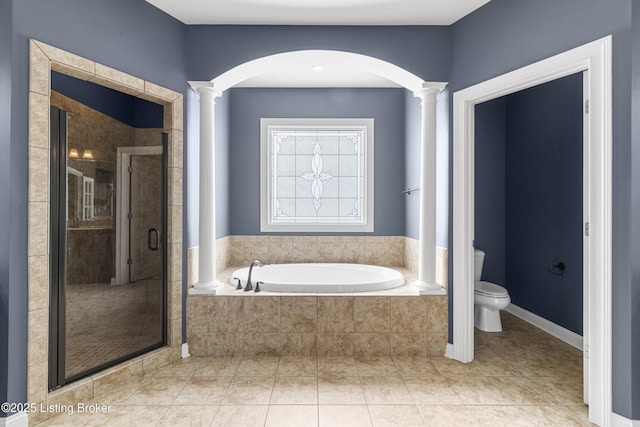 bathroom with ornate columns, toilet, tile patterned flooring, and plus walk in shower