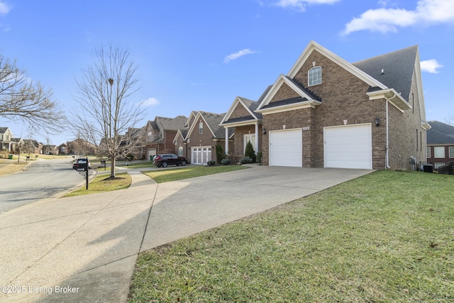 view of front of property featuring a garage and a front lawn