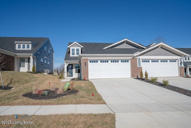 view of front of property featuring a garage and a front lawn