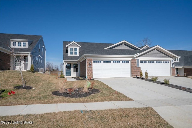 view of front of property with a garage and a front lawn