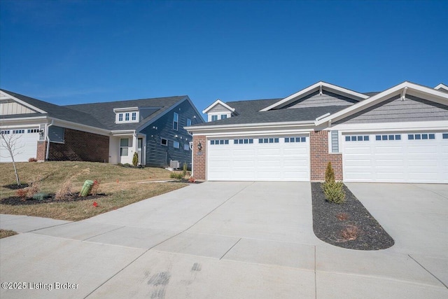 view of front of house featuring a garage and a front lawn