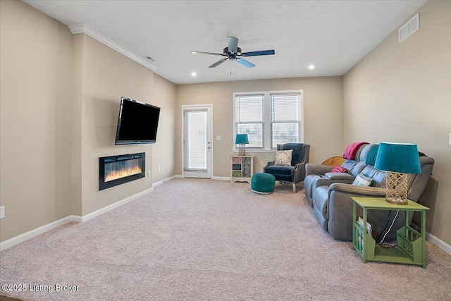 carpeted living room featuring ceiling fan