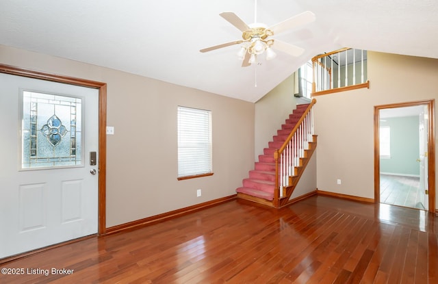 foyer featuring hardwood / wood-style flooring, ceiling fan, and vaulted ceiling