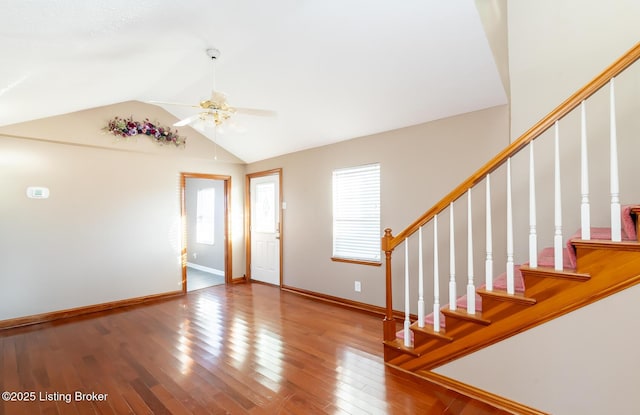 entryway featuring wood-type flooring, lofted ceiling, and ceiling fan