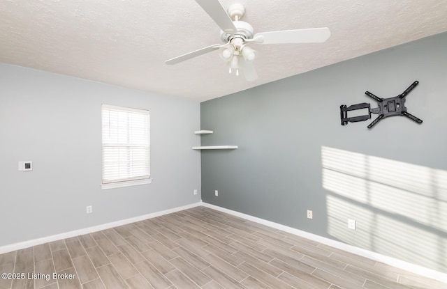 unfurnished room featuring a textured ceiling, ceiling fan, and light hardwood / wood-style flooring