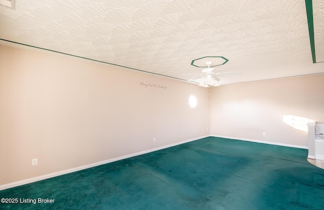 carpeted spare room featuring a textured ceiling