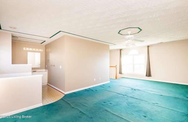 carpeted spare room with a textured ceiling