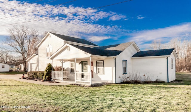 rear view of house featuring a porch and a yard